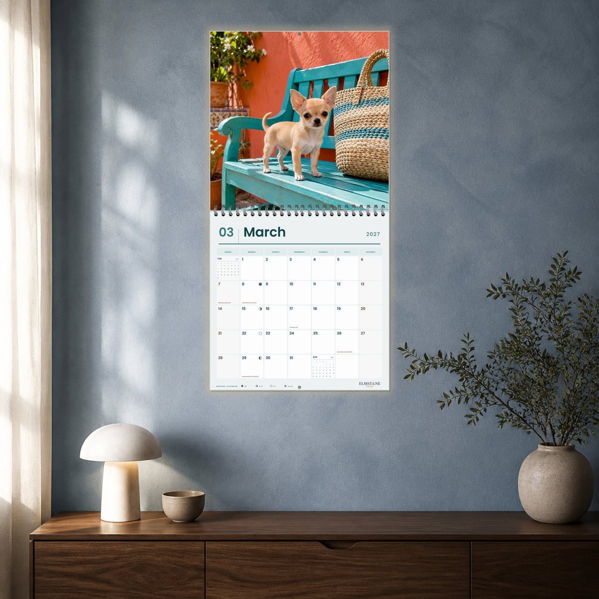 2027 Chihuahua Puppies Wire-O square wall calendar - open calendar displayed in a blue studio march