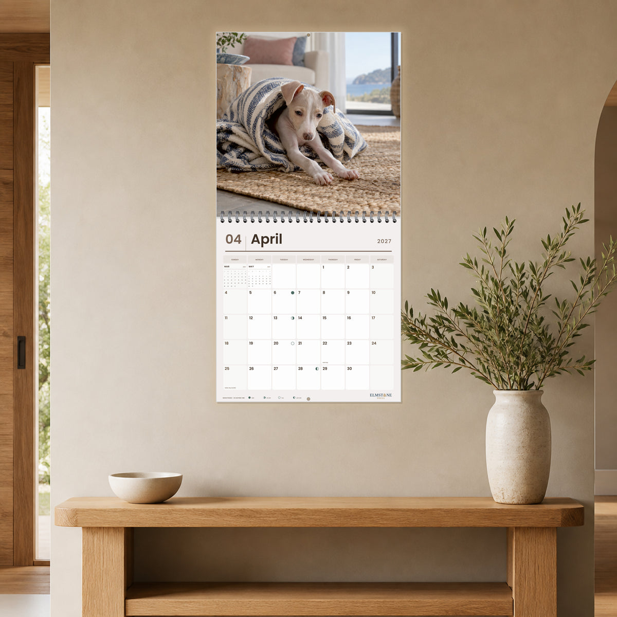 2027 Italian Greyhound Puppies Wire-O square wall calendar - open calendar displayed in a taupe entry april
