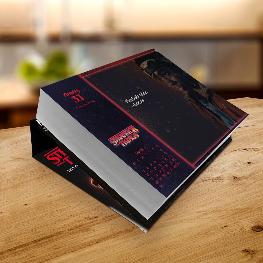 Stranger Things 2027 boxed page-a-day calendar displayed on a desk