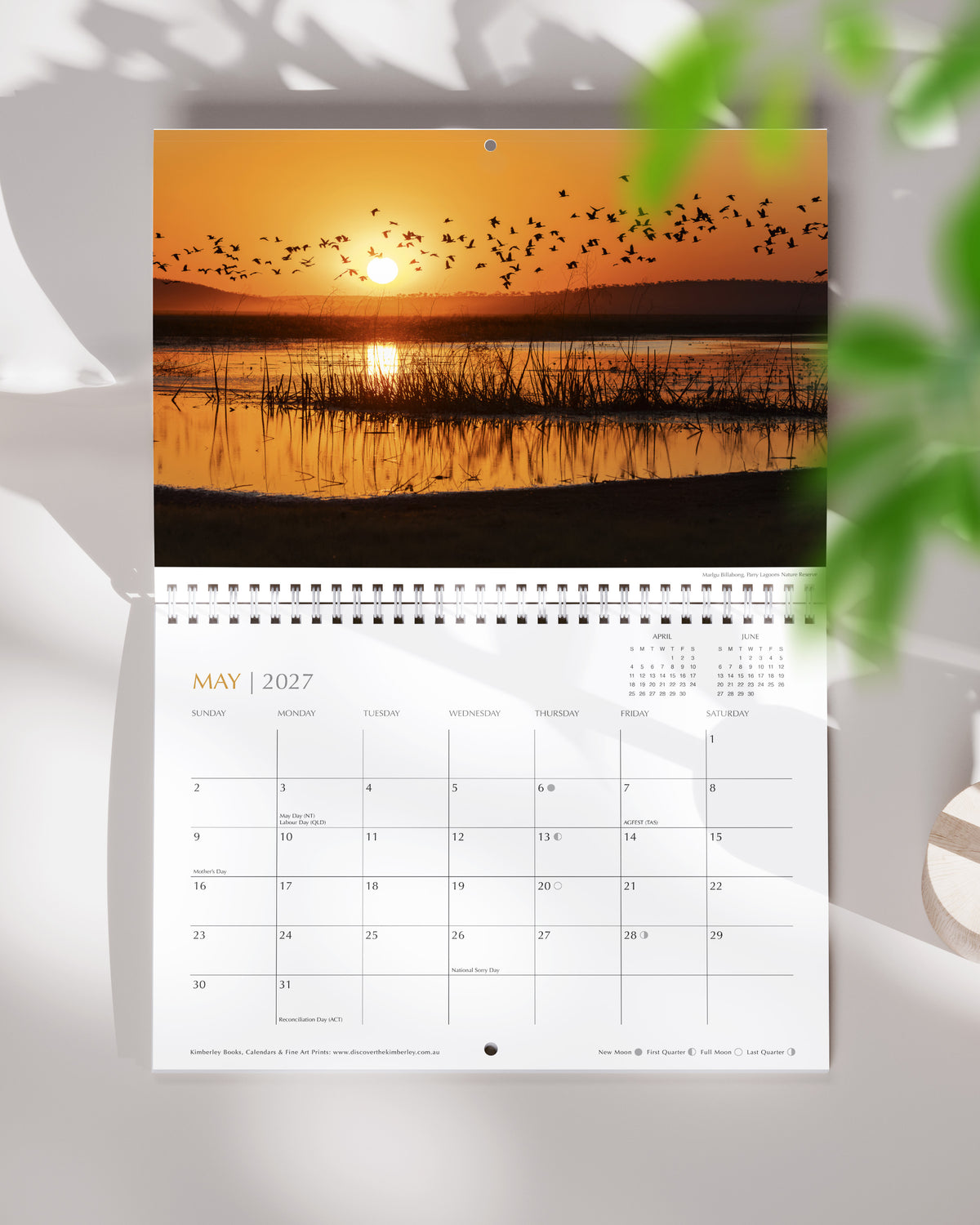 The Kimberley 2027 spiral wall calendar hanging open at May with a Sunday-start monthly date grid