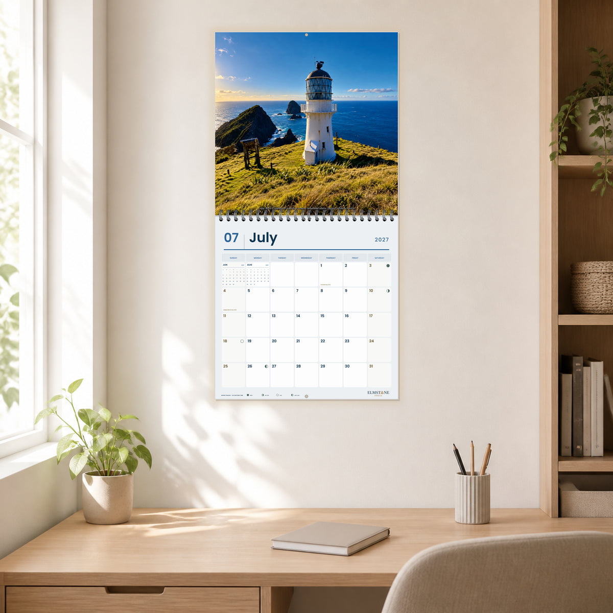 2027 Bay of Islands New Zealand Wire-O square wall calendar - open calendar displayed in a home office july