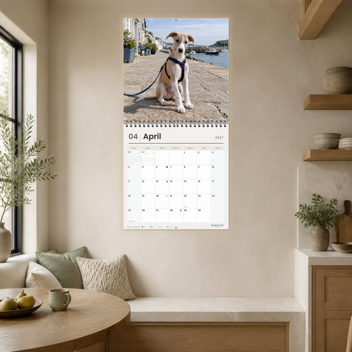 2027 Whippet Puppies Wire-O square wall calendar - open calendar displayed in a breakfast nook april
